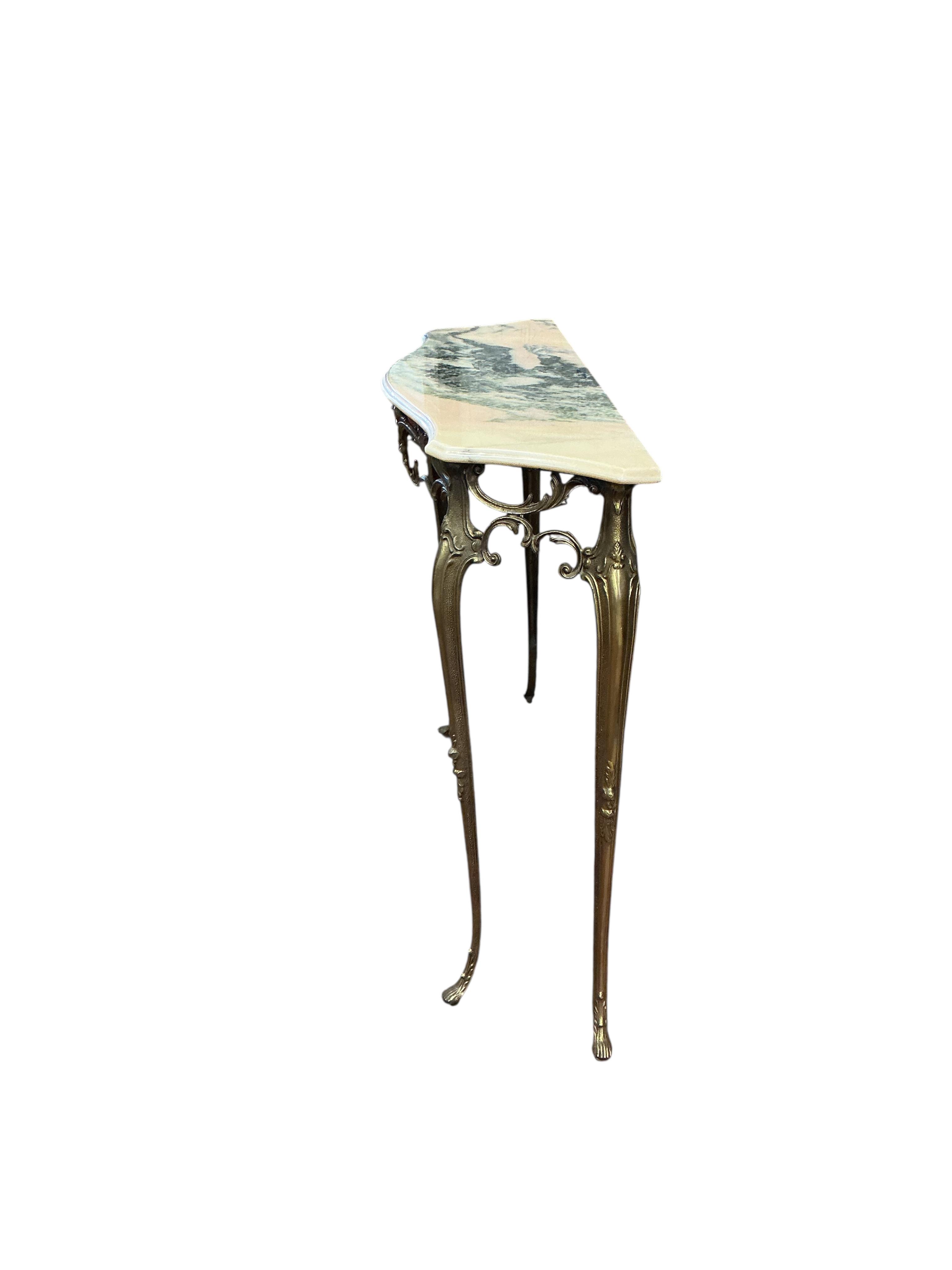 A mid century brass and reconstituted marble serpentine console table, width 90cm, depth 28cm, height 76cm